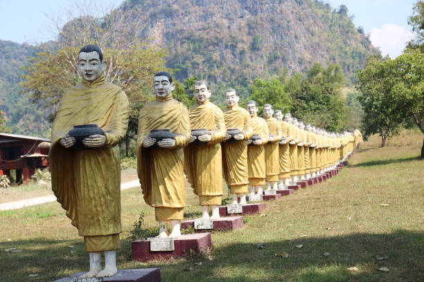 istock Row Buddhist monk statues in Myanmar 1206602342