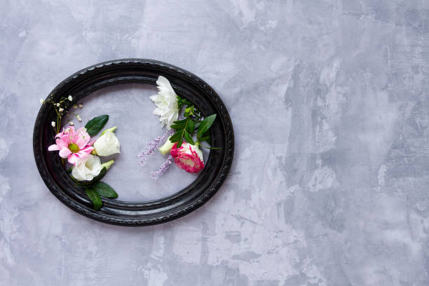 istock Flowers in frame isolated on grey background 1206602530