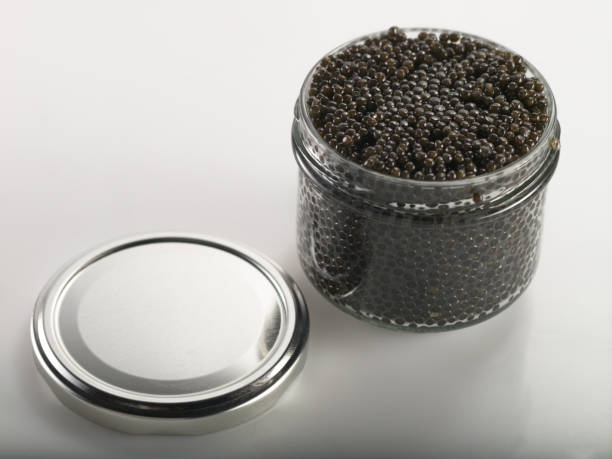 istock Black caviar in a jar on a neutral background 1206603319