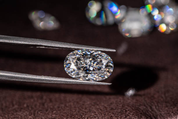 istock Diamond in Tweezers 1206603486