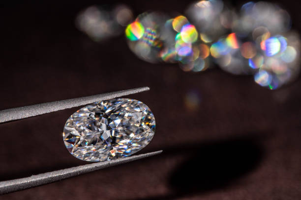 istock Diamond in Tweezers 1206603495