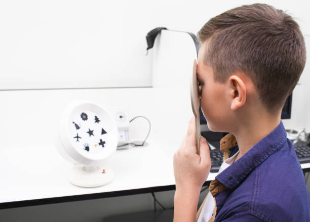 istock Boy receives hardware treatment for amblyopia. Amblyopanorama - a simulator for stimulation of the retina. Children's treatment for visual acuity 1206604150
