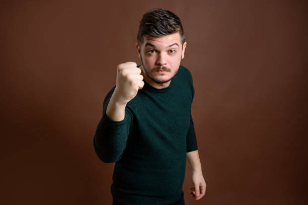 istock Young man shows his fist 1206605348