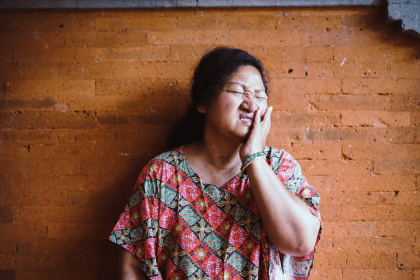 istock Southeast Asia Old Woman - Tooth Ache 1206606663
