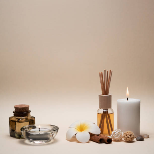istock Beautiful spa composition with candles, frangipani flower, oil flasks and other decor elements. 1206606735