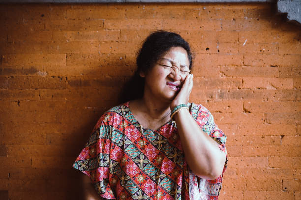 istock Southeast Asia Old Woman - Tooth Ache 1206606772