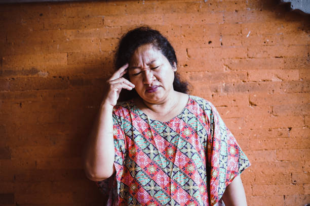 istock Southeast Asia Old Woman - Headache 1206607051