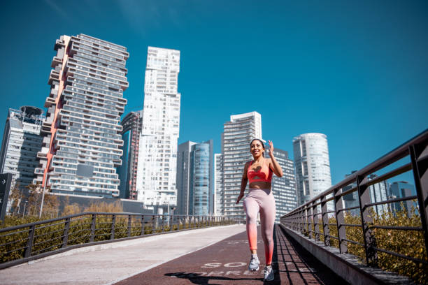 istock Young woman jogging 1206607176