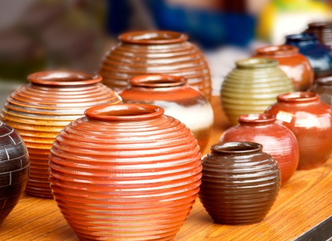 Glazed ceramics are for sale at an outdoor market
