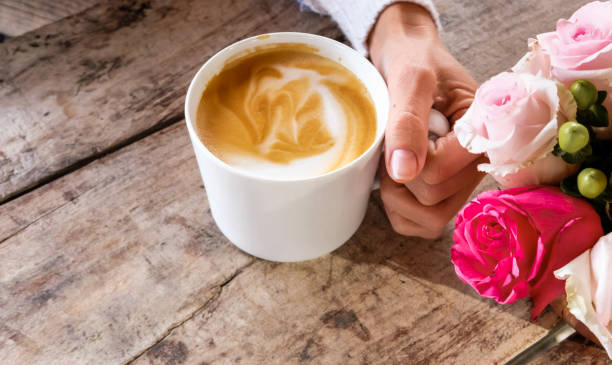 istock Cup of coffee latte and flowers. 1206608378