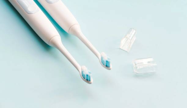 istock Electric toothbrush on blue background. 1206608904
