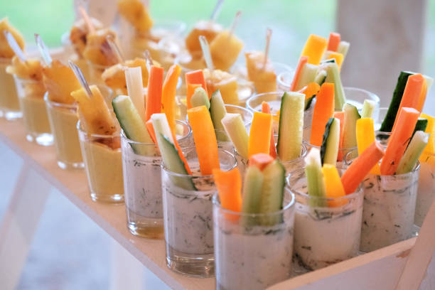 istock Vegetable snacks in glasses on a banquet table. 1206609100