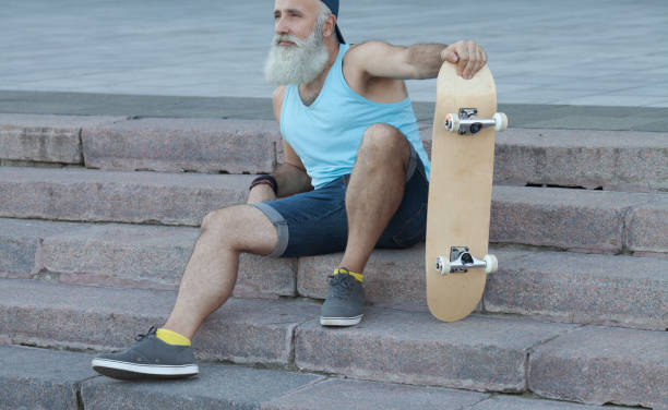 istock Trendy bearded senior man with skateboard 1206613044