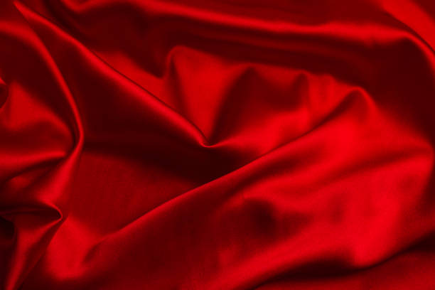 istock Red silk or satin luxury fabric texture can use as abstract background. 1206613081