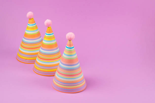 istock Birthday cap on pink background. 1206613146
