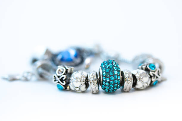 istock Beautiful bracelet with charms isolated on white background 1206613200