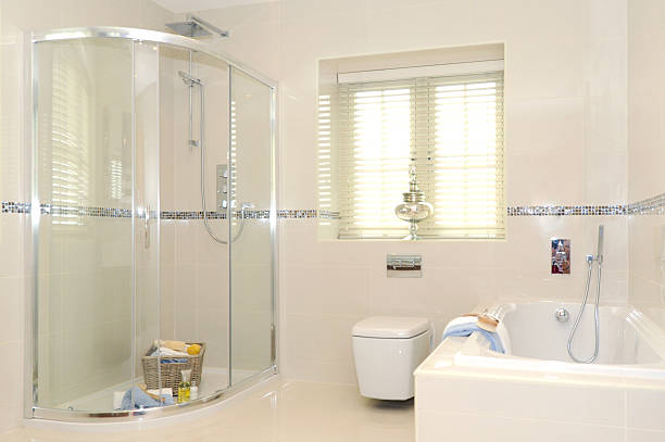 bathroom a quality bathroom including shower and enclosure, toilet and bath, with white tile decoration enclosure stock pictures, royalty-free photos & images