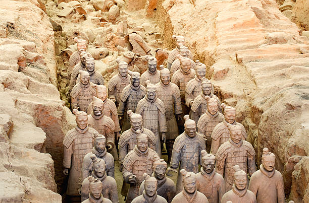 The famous terracotta warriors, stone sculptures depicting Shi Huangdi's army. Shi Huangdi was the first emperor of China. Behind you can see buried bodies yet to be excavated and pieced back together in an ongoing reconstruction project lasting many decades. 