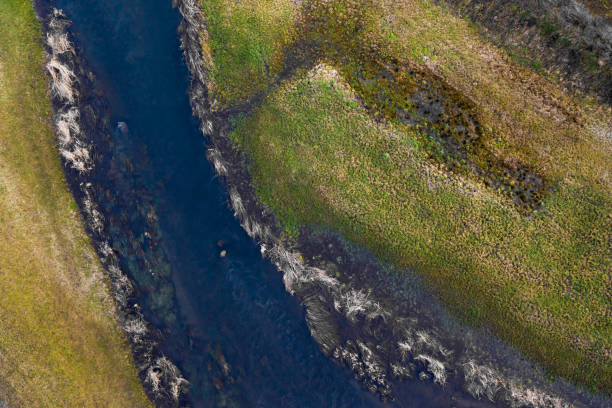 istock a river overflowing in winter from above 1206616042