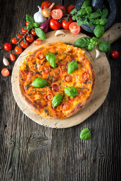 istock homemade pizza margherita with mozzarella, basil and tomatoes 1206618192