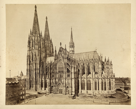 Antique photograph of Cologne Cathedral, Germany, 19th Century. A Catholic cathedral in Cologne, North Rhine-Westphalia, Germany. It is the largest Gothic church in Northern Europe and has the second-tallest spires. The towers for its two huge spires give the cathedral the largest façade of any church in the world.
