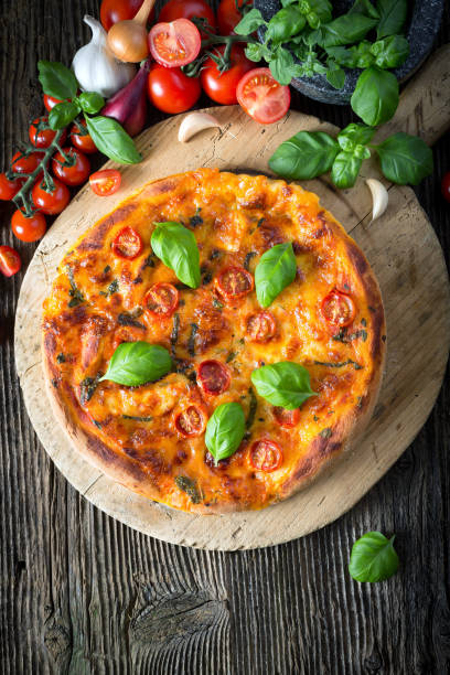 istock homemade pizza margherita with mozzarella, basil and tomatoes 1206618325
