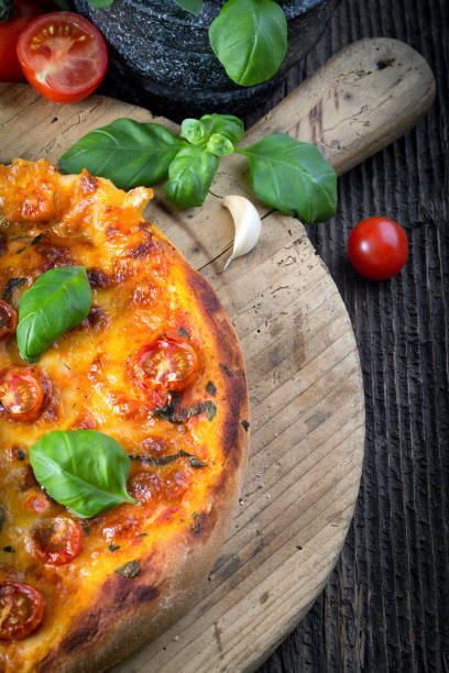 istock homemade pizza margherita with mozzarella, basil and tomatoes 1206619021