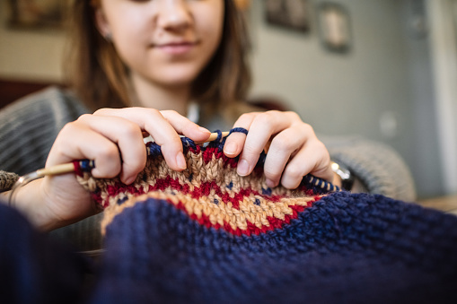 Teenage girl knitting Jacquard sweater