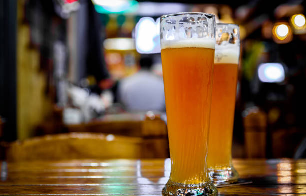 istock two glass of light beer stands on a table in a bar or pub 1206619542