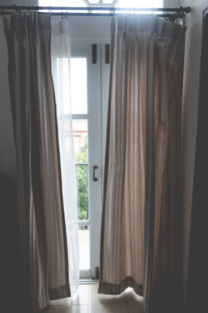 istock Brown curtains in a sliding door at home 1206621732