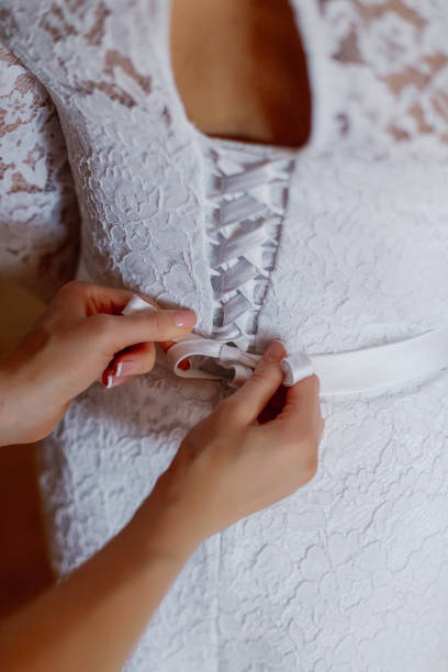 istock A young bride buttoned wedding dress. Happy wedding day 1206621814