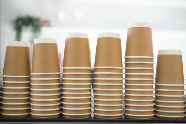 istock Close up stack of disposable reclying paper cup on coffee machine at coffee shop 1206621899