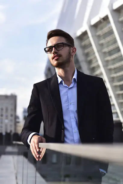 Photo of Portrait of confident handsome man, in elegant suit, successful businessman