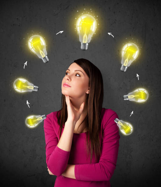 istock Young woman thinking with lightbulb circulation around her head 1206628869