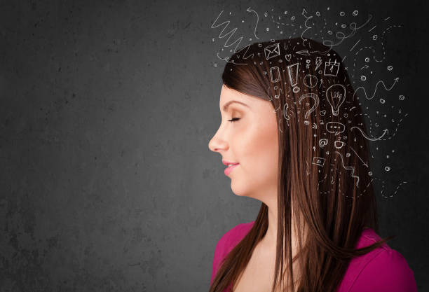 istock Young girl thinking with abstract icons on her head 1206628918