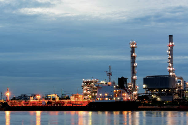 istock oil refinery industry plant along twilight morning 1206629092
