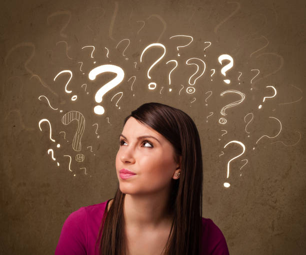 istock girl with question mark symbols around her head 1206629093