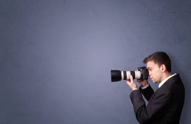 istock Young photographer shooting images with copyspace area 1206629270