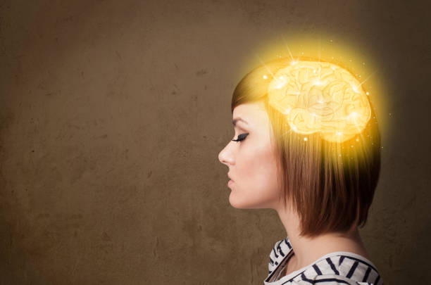 istock Young girl thinking with glowing brain illustration 1206630312
