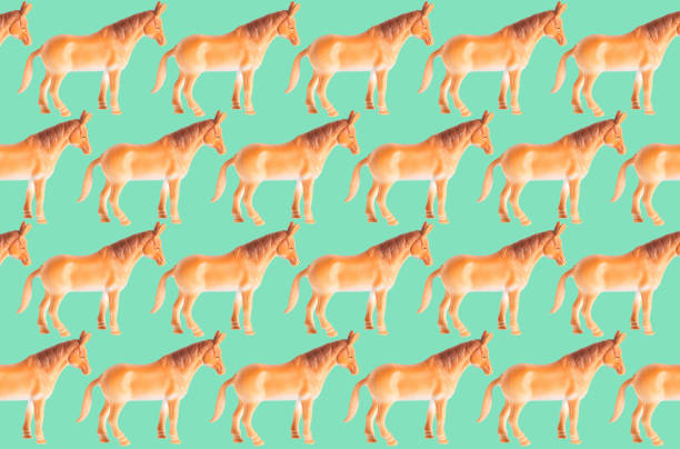 istock Plastic horse doll isolated on color background 1206630701