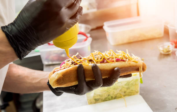 istock The chef cooking hot dog on a grill. Restaurant. 1206633558