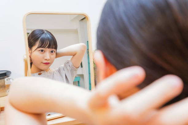 istock Young woman setting her hair 1206633834