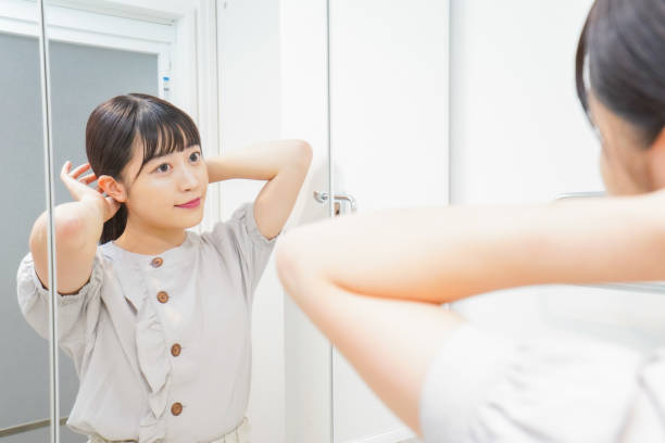 istock Young woman setting her hair 1206633846