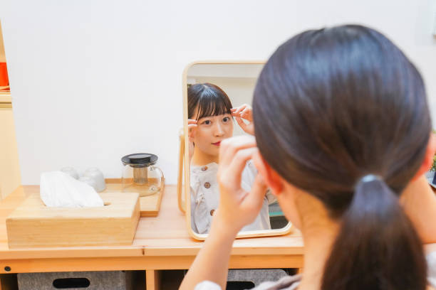 istock Young woman setting her hair 1206633902