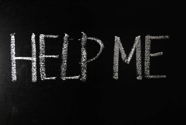 istock Word help me written in white chalk on a black chalkboard. 1206635130