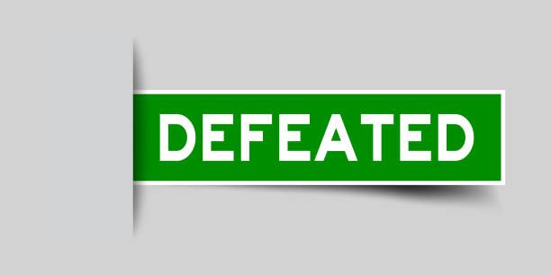 istock Label sticker green color in word defeated that inserted in gray background 1206636512