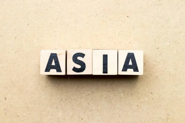 Photo of Letter block in word asia on wood background