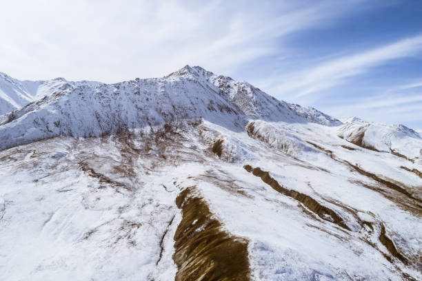 lanscape with barren mountain which is covered with ice
