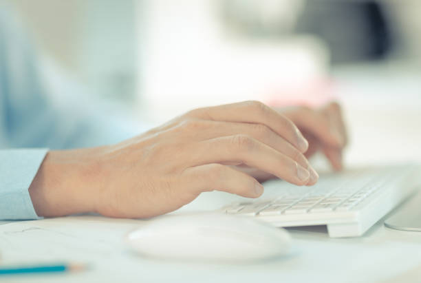 istock Hands of young businessman is typing on white keyboard 1206641488