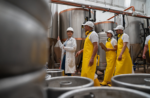Group of new Latin American operators in training at a brewery factory - industrial concepts